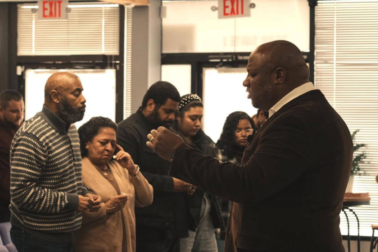 Praying together at Word of Life Northwest